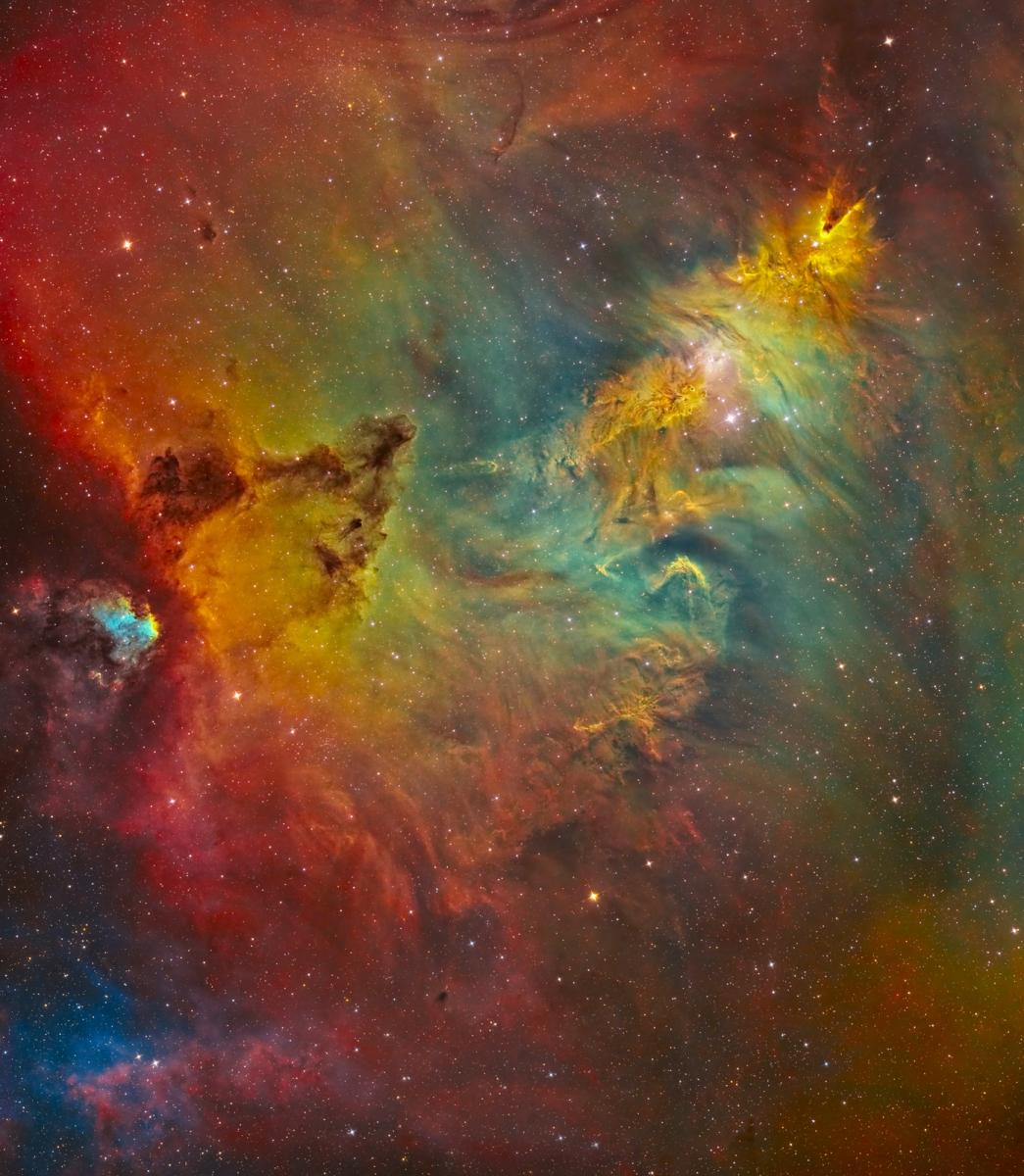 Deep space image showing a rainbow cloud of cosmic gas and dust