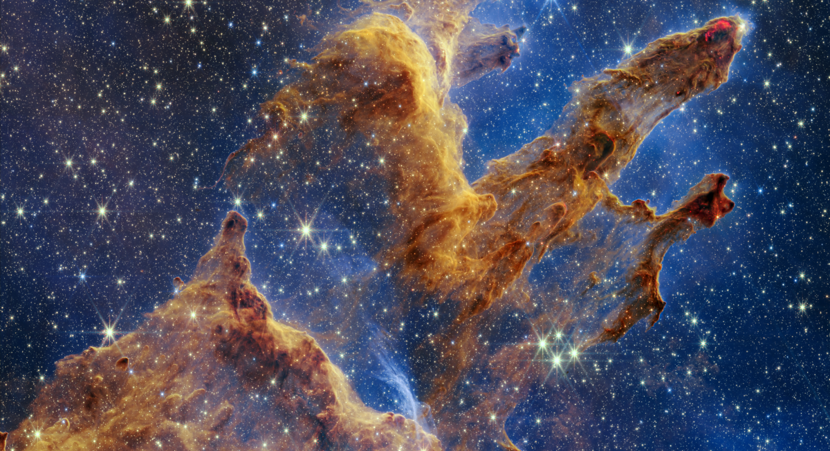 Image showing blue and black sky with slightly transparent golden and brown dust clouds, through which many stars are visible