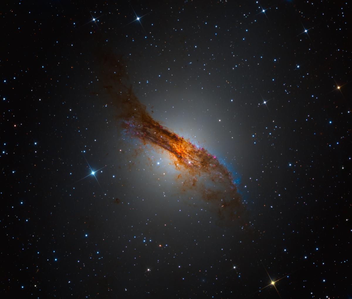 Side on image of a bright orange galaxy