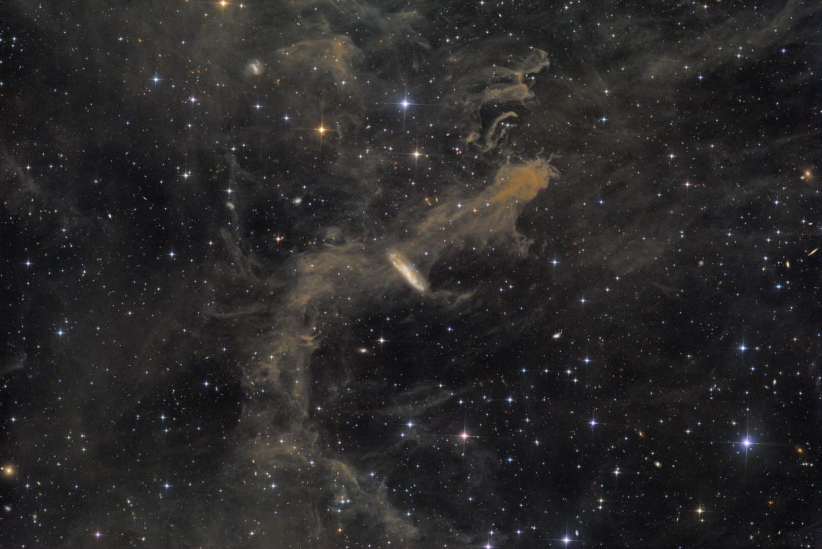 Image of a galaxy and a molecular cloud in a star constellation