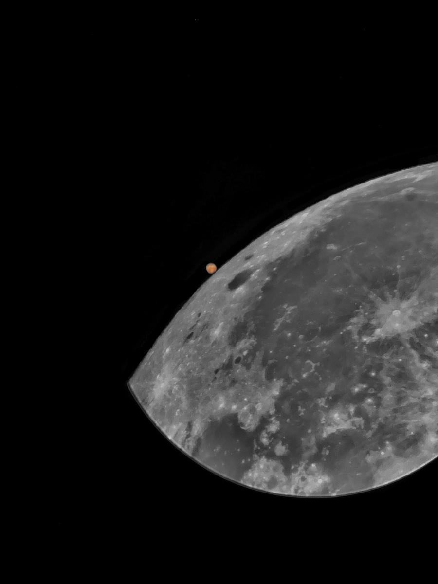 Mars visible behind lunar surface of the Moon