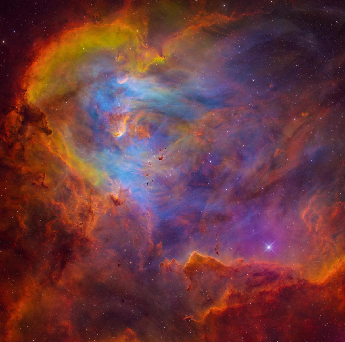 Rich red, yellow and blue colours of Running Chicken Nebula