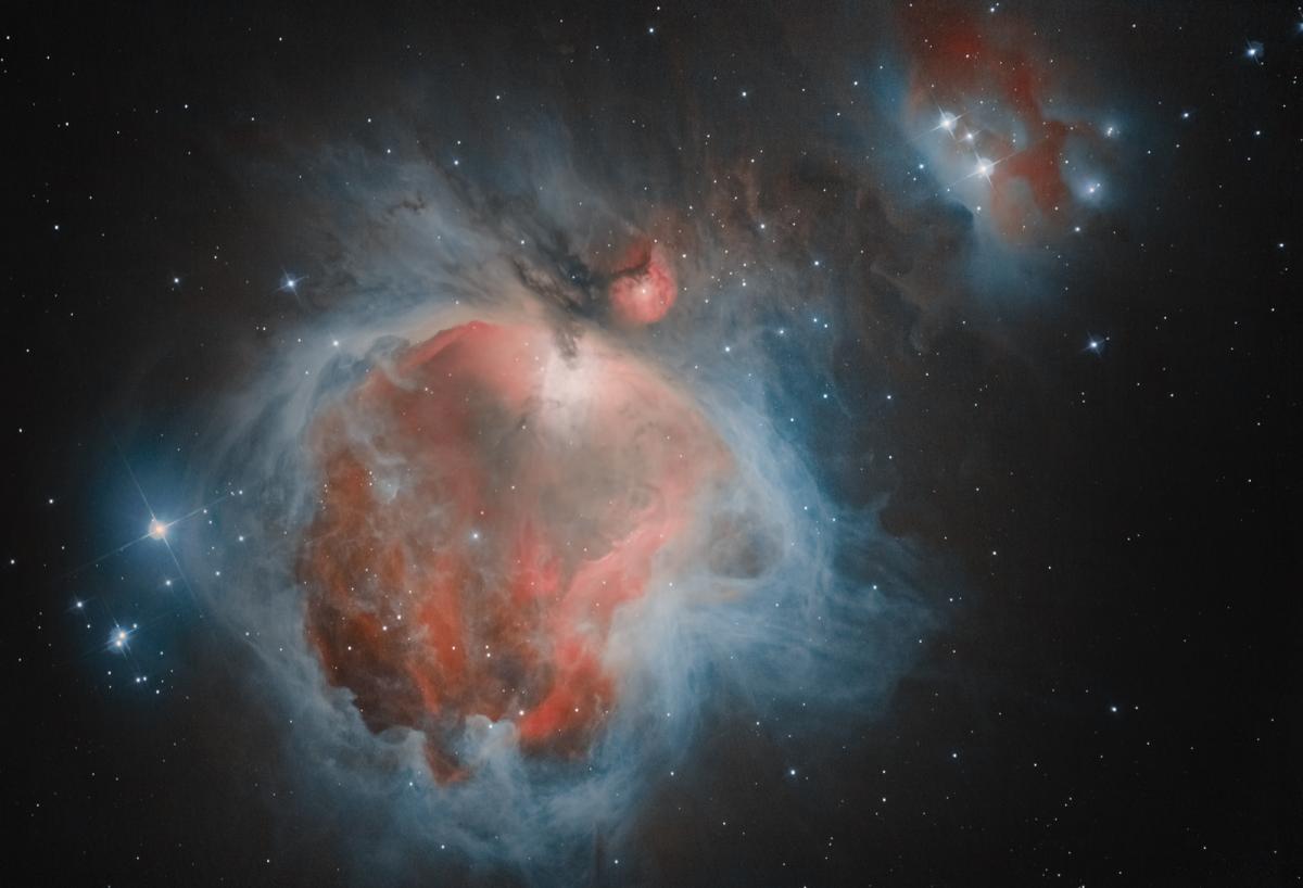 Blue and red gases and stars in the Orion Nebula