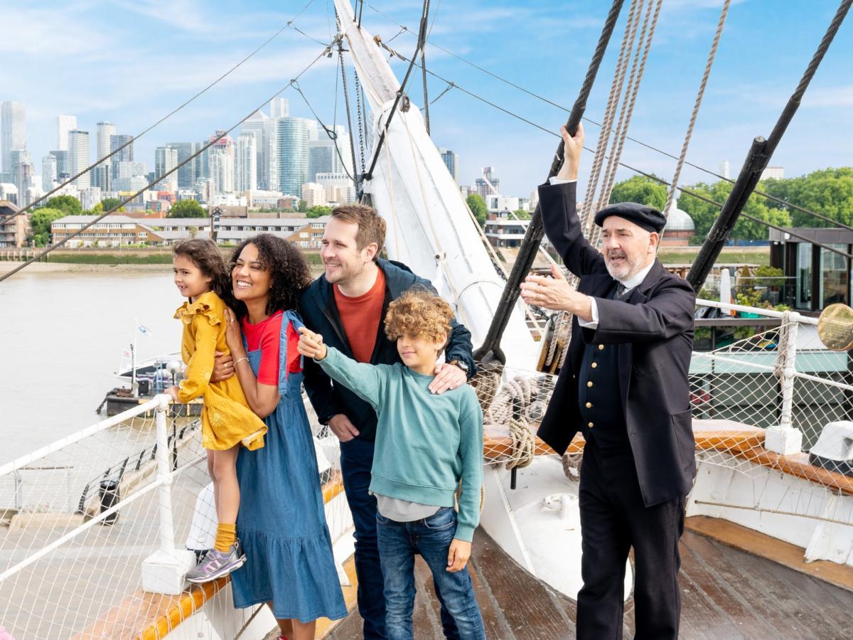 People looking and pointing from a ship 