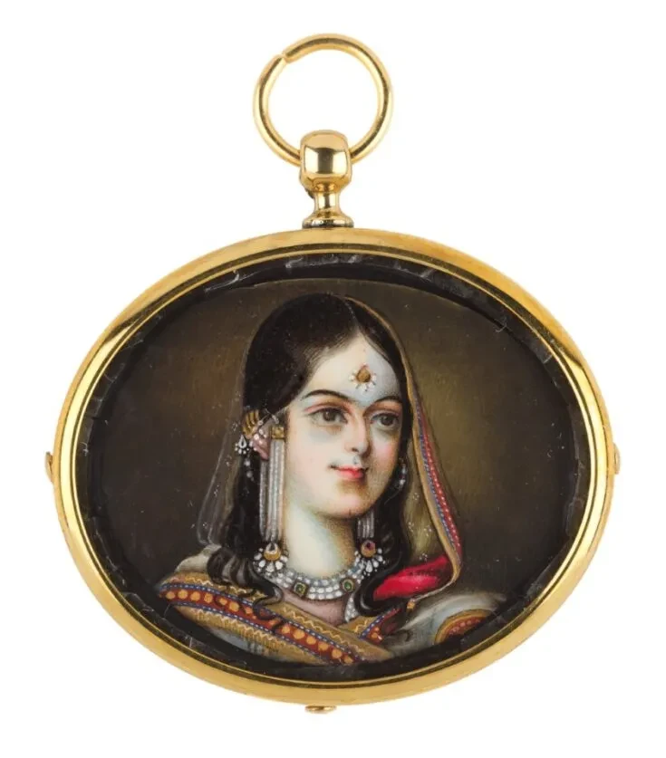 a cameo with a painting of a Indian Queen with gold surround