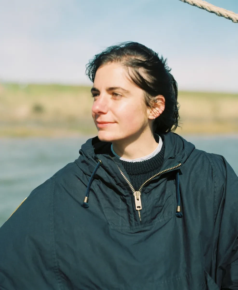 A picture of a woman on a sailing yacht