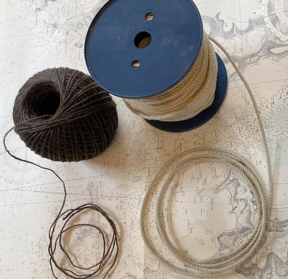 Image of two large spools of thin rope