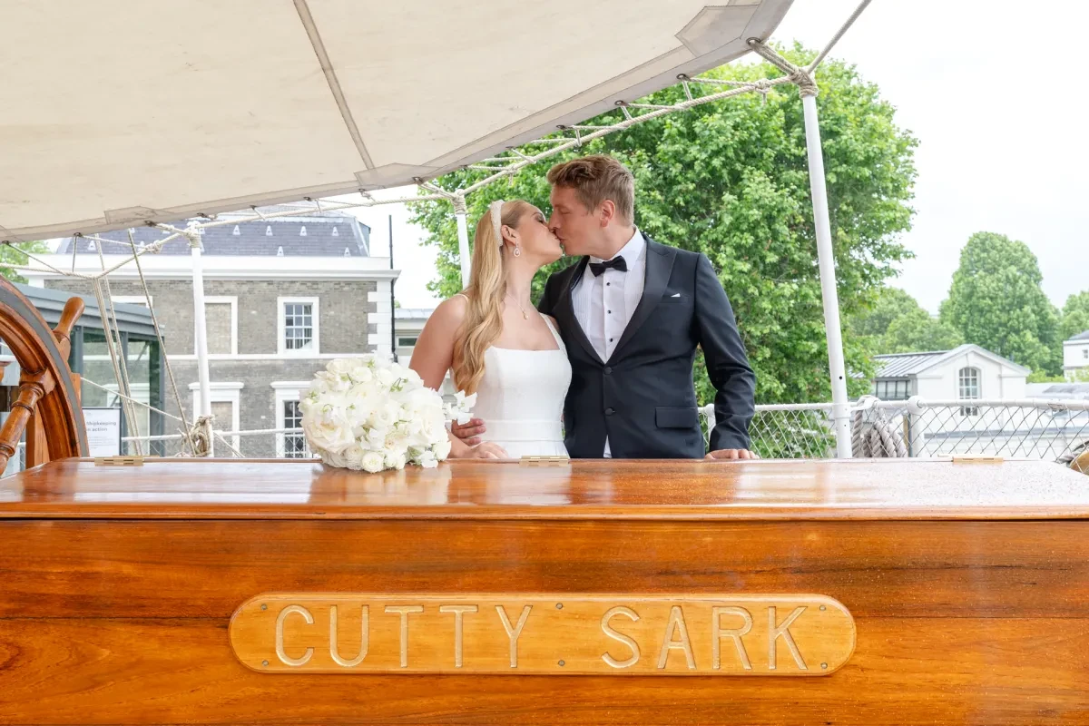 wedding couple standing on the weather deck