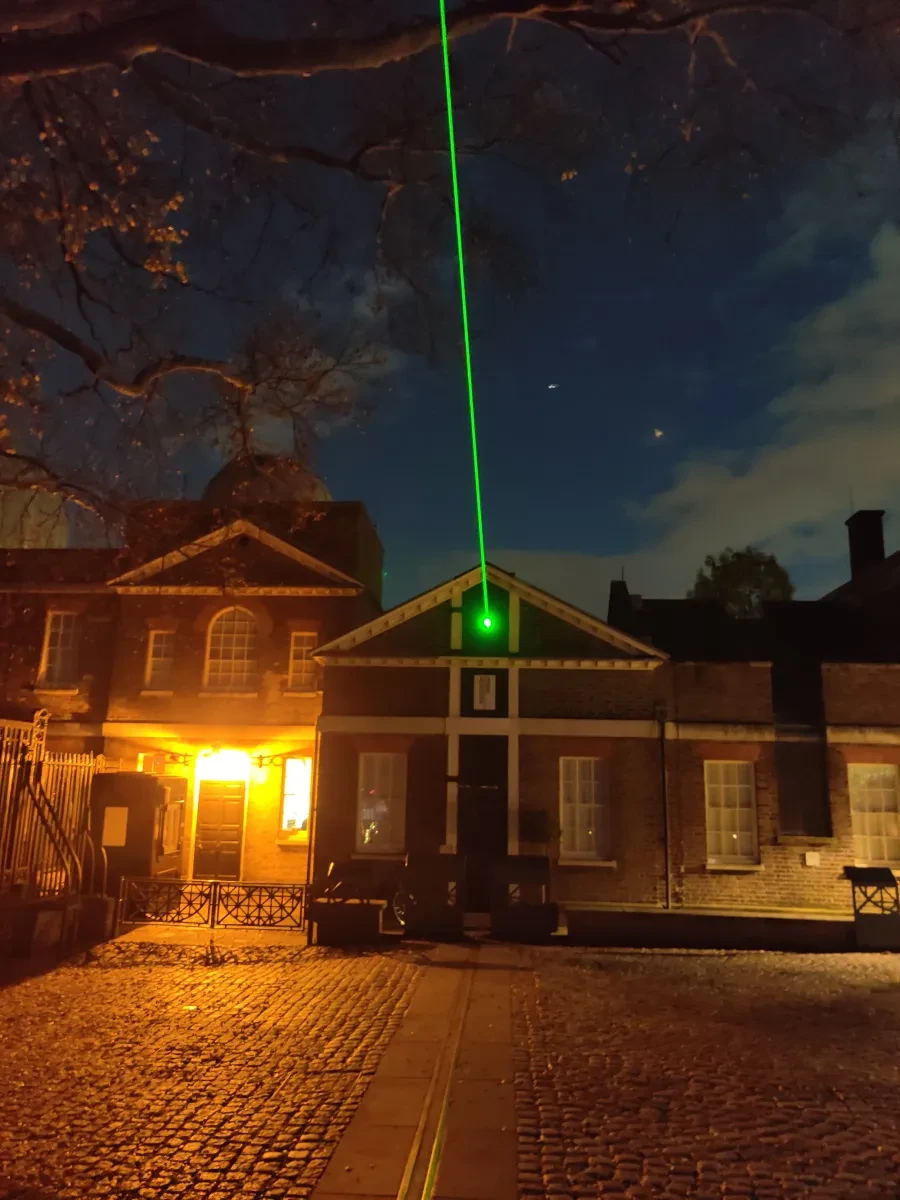 The Meridian laser beam marking the Prime Meridian line from the Royal Observatory at night