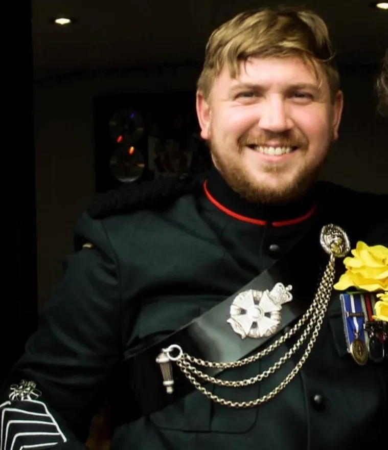 colour photo of a man with facial hair and military uniform with medals