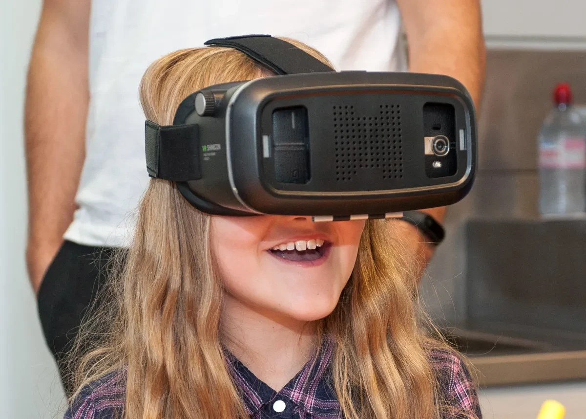 A girl looks through a VR headset during a Royal Observatory science activity