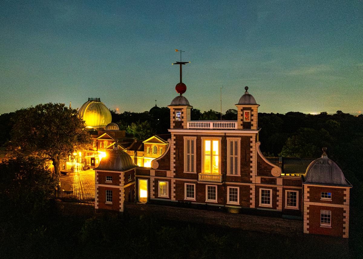 Drone photograph of the Royal Observatory lit up at night