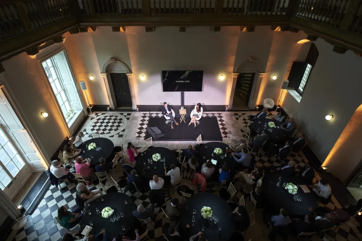 Great Hall in conference setup with discussion panel