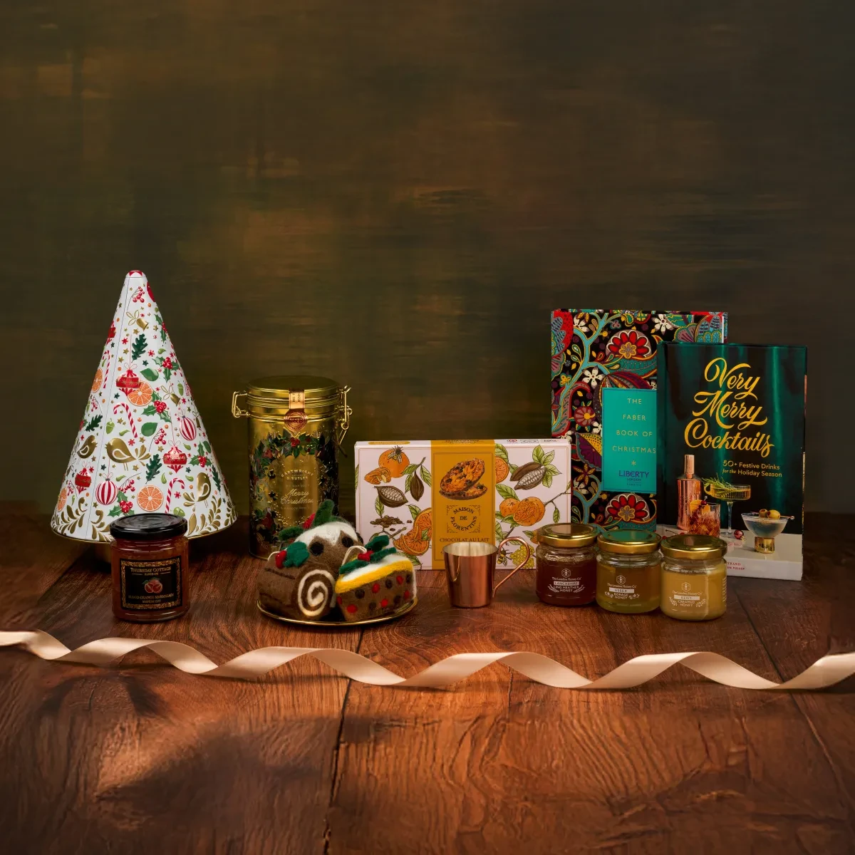 Selection of Christmas gifts including biscuits and jams