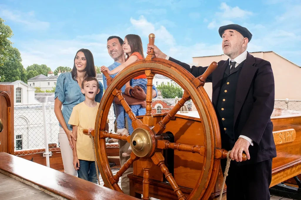 Family at Cutty Sark Wheel with character actor Captain Woodget