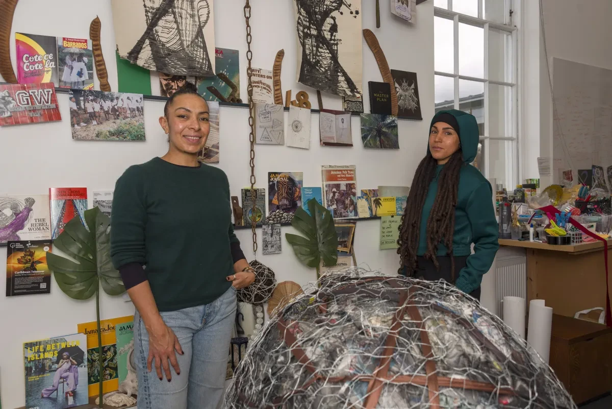 Photo of two people standing in a workshop