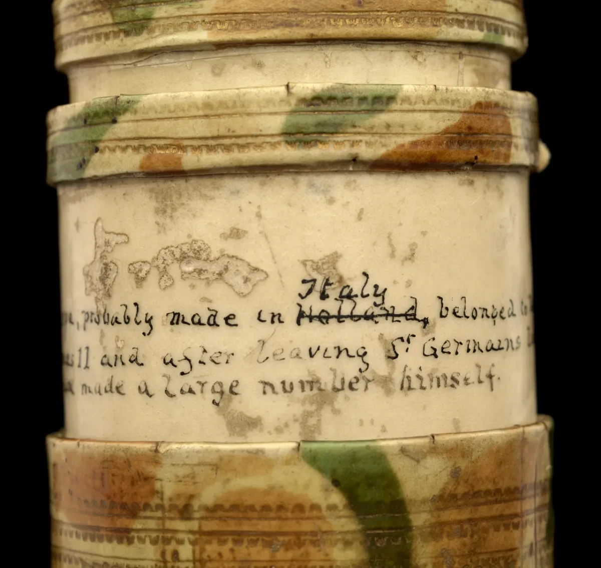 An inscription written on the side of an old telescope. The word 'Holland' has been crossed out and 'Italy' written above