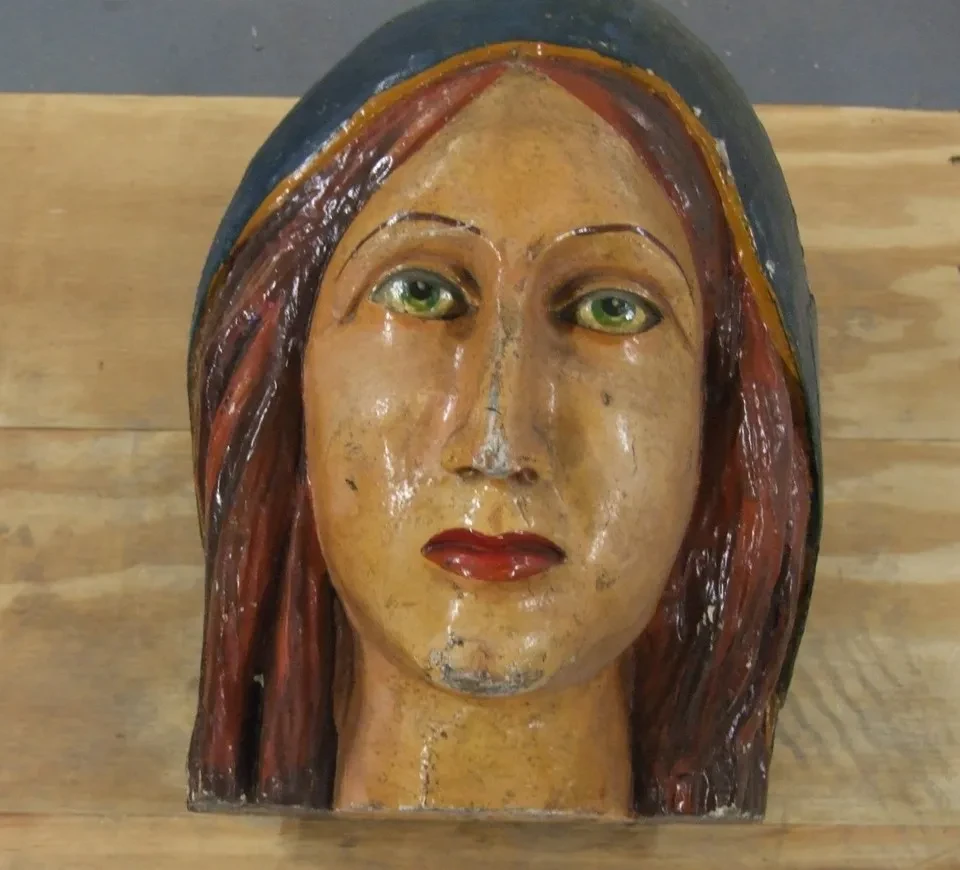 Figurehead, female figure with red hair wearing a blue mantle