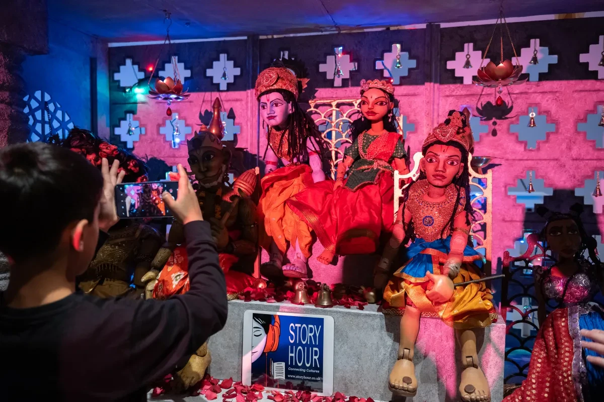 Colourful puppets are on a stage
