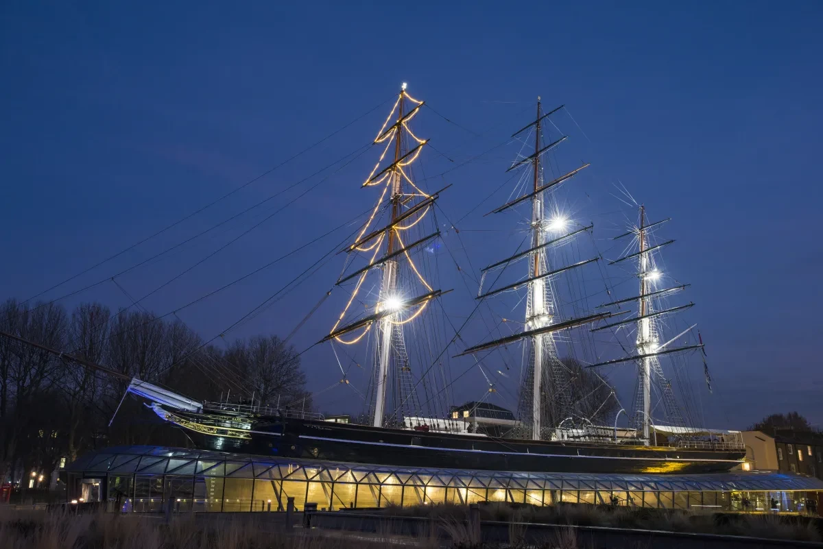 Cutty Sark at night with mast lit up like a Christmas tree