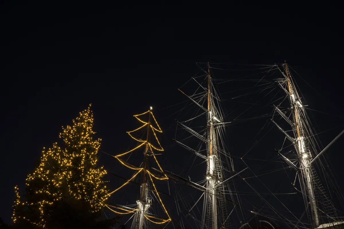 Cutty Sark lit up with Christmas lights at night