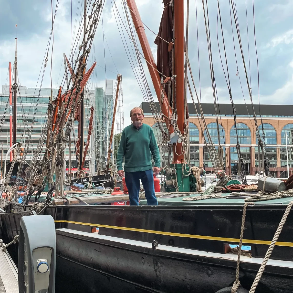 Thames barge skipper Gordon 'Willie' Williamson, photographed in St. Katherine's Dock on board the Ardwina