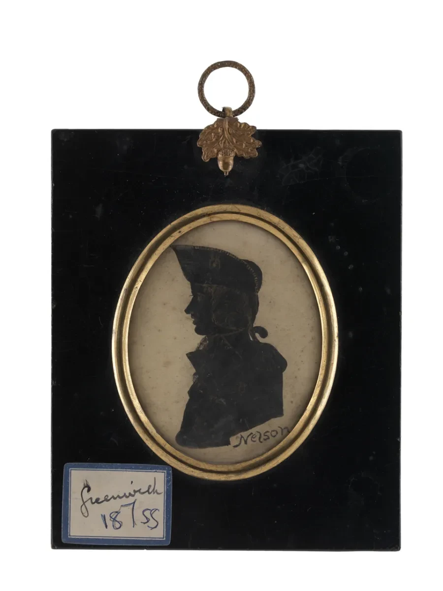 Black silhouette on white card in an oval gilded surround set in a rectangular black-lacquered backing board, with a brass suspension ring and hanger of a gilded acorn and oak leaves, top centre. The sitter is shown in left profile, long bust-length, wearing a cocked hat and a flag-officer's uniform