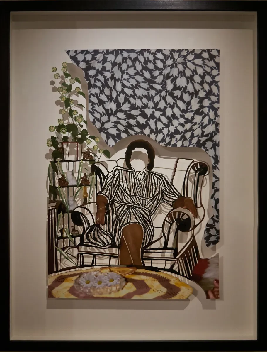 A paper cut collage artwork showing a woman sitting in an armchair in a sitting room