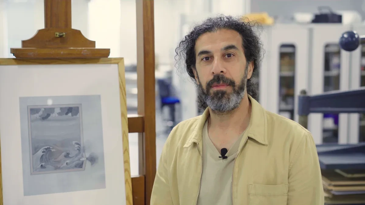 Man in front of painting