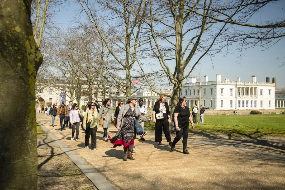 Group tour with Queen's House in background