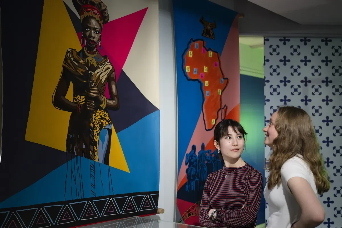 Two young women look at exhibits in the National Maritime Museum.