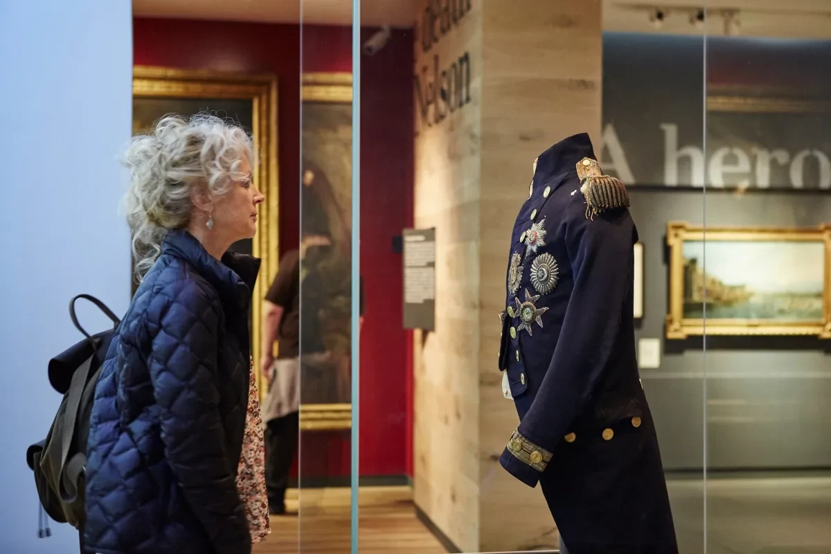 Visitors looks at Nelson's Trafalgar Coat 
