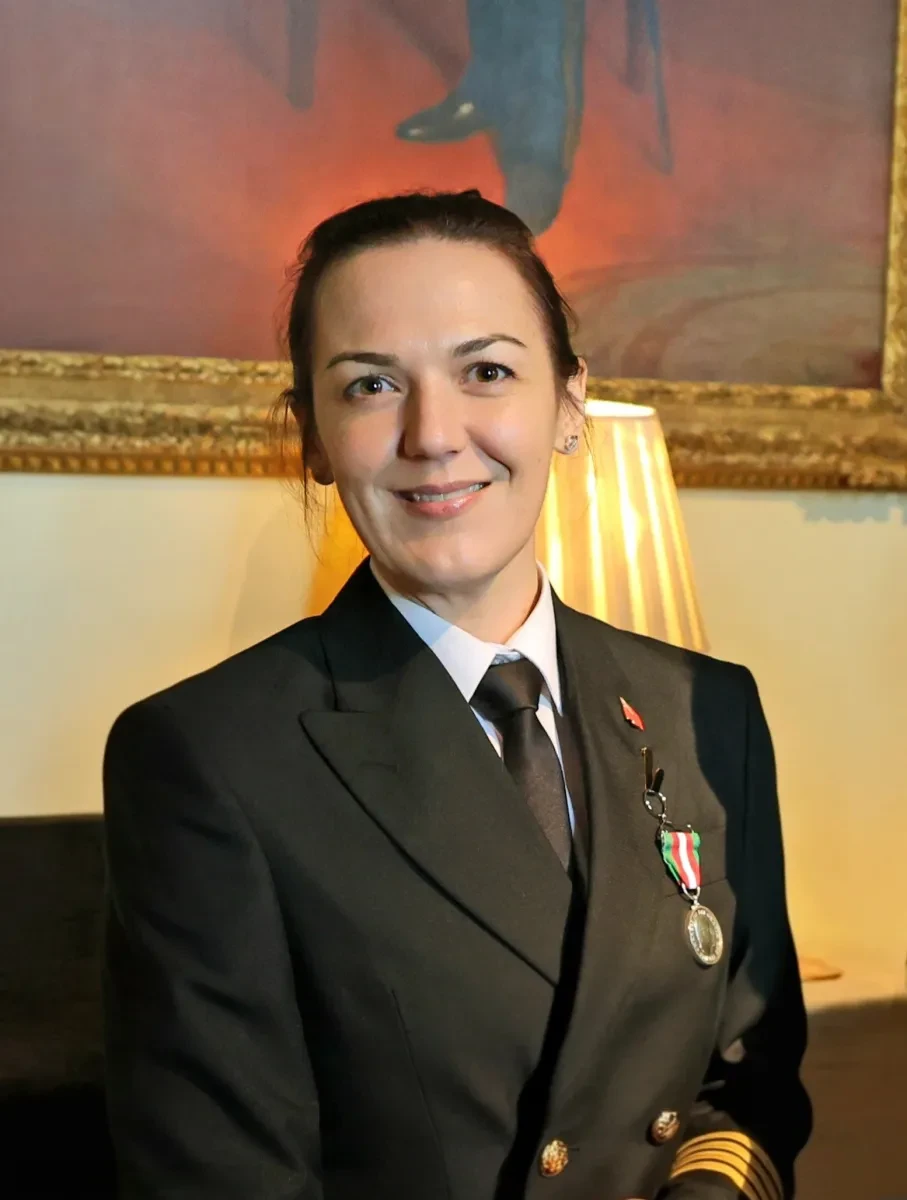 Captain Philippa Bowden wearing a dark uniform with a medal