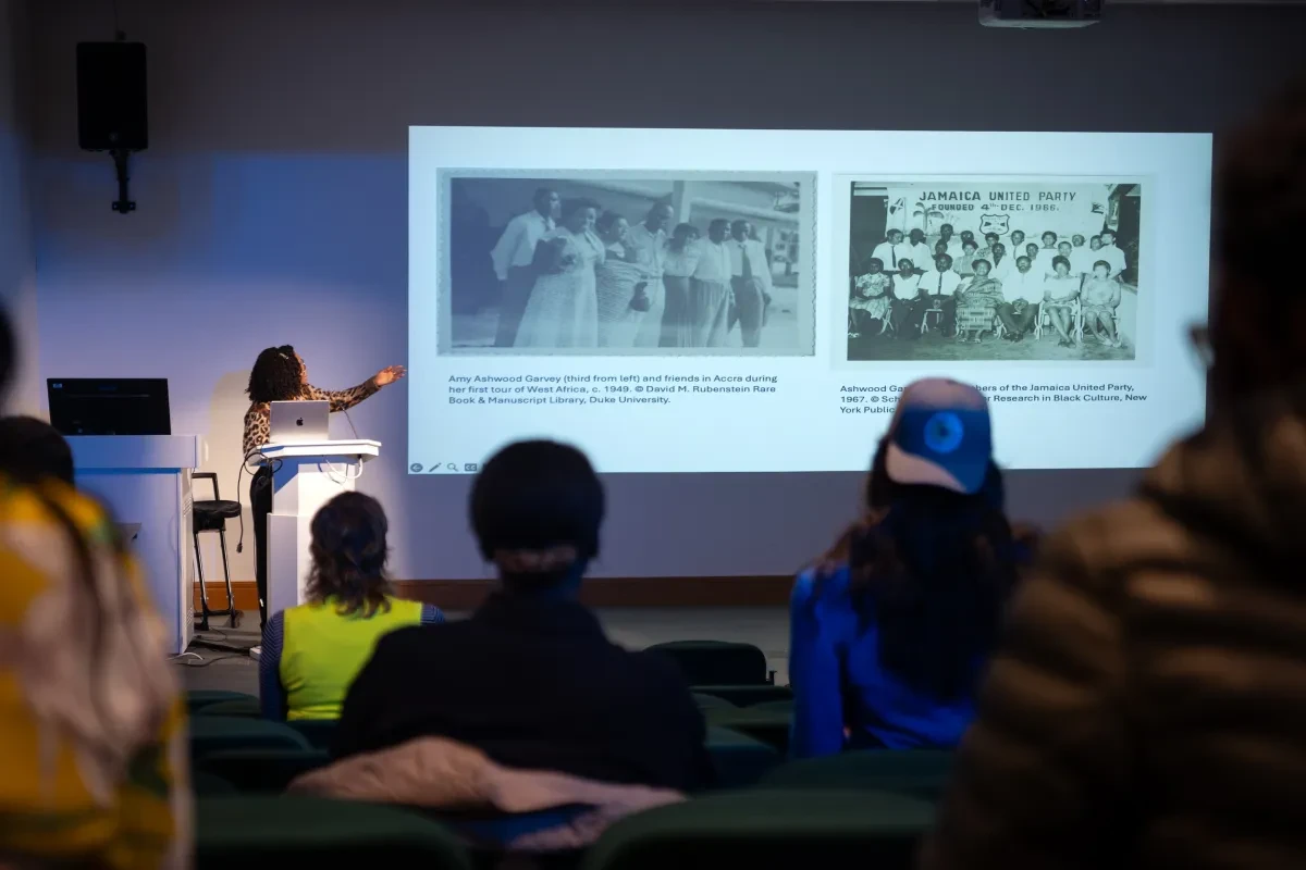 A presenter gives a talk in a lecture theatre