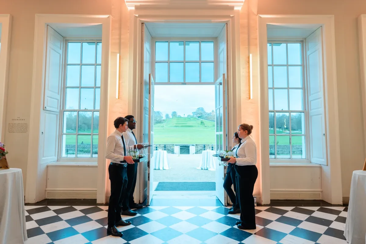 The Orangery in soft golden uplighting, ready to greet guests 