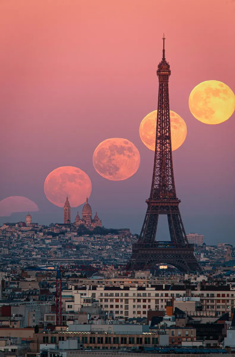 Paris landscape at pink sunset, with four Moons composited together rising in sky behind the Eiffel Tower, from faint to solid orange