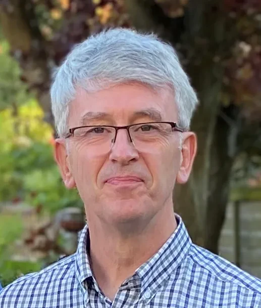 Headshot of Martin Lewis smiling at the camera