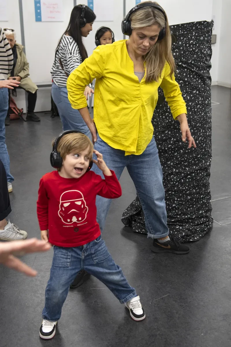 A woman and child are taking part in a movement workshop