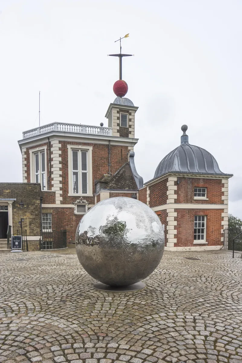 Mirrored Moon sculpture in courtyard of historic Royal Observatory Greenwich