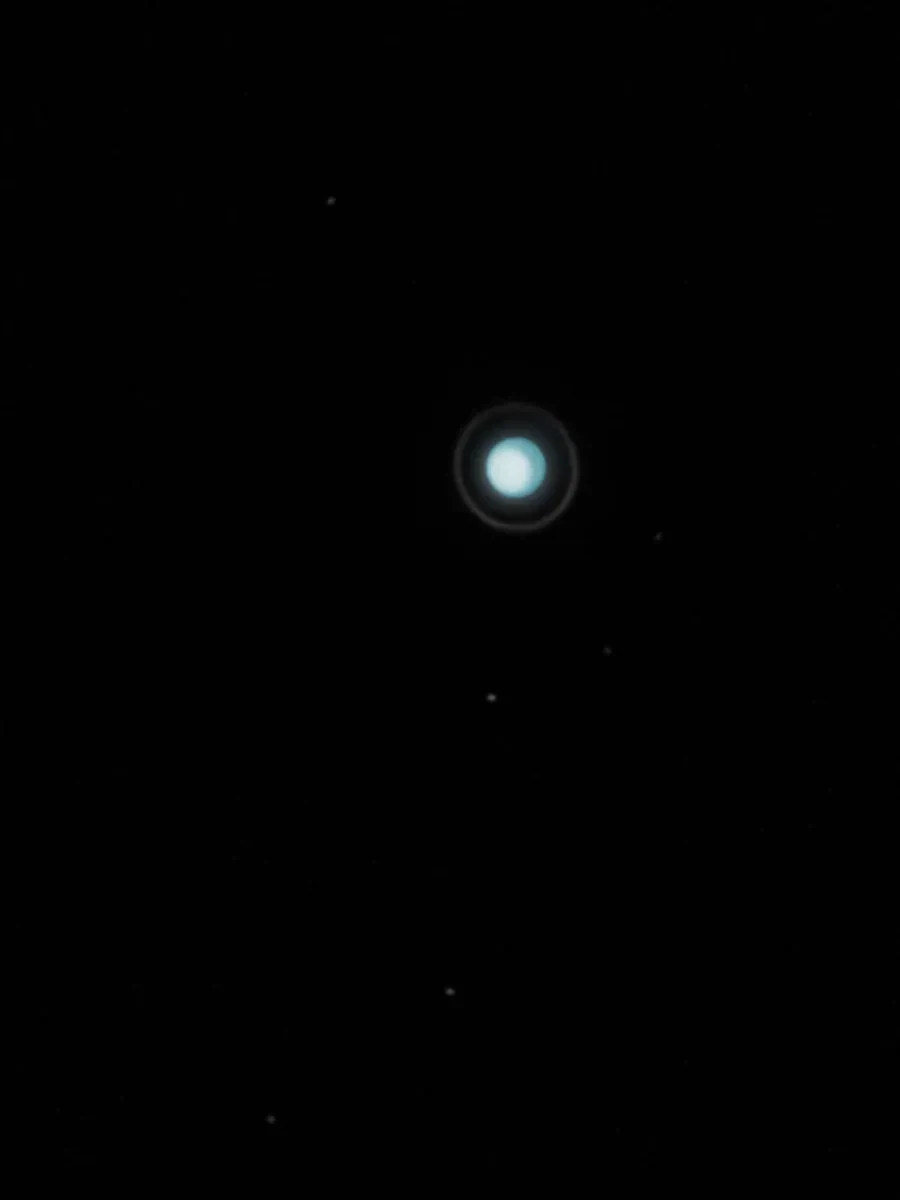 Icy image of Uranus surrounded by a ring