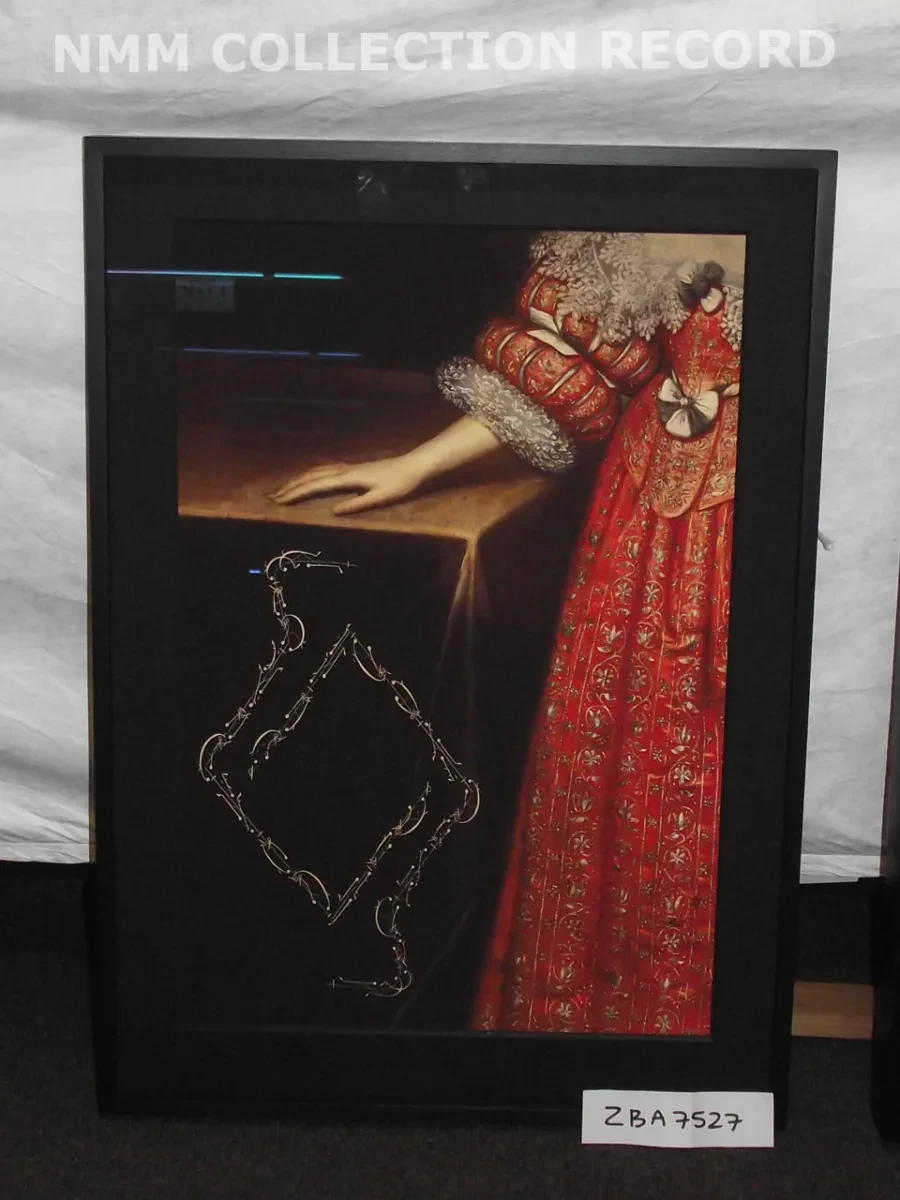 a women in a red dress standing beside a wooden desk,hand resting on top but only the leg and arm in frame. In front of the desk, Calligraphy in gold in the  shape of a diamond.