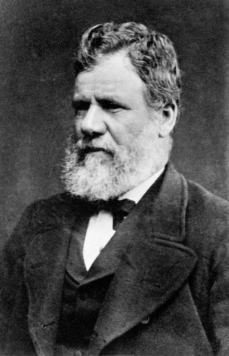 A black and white photograph of Captain George Moodie wearing a beard and suit.