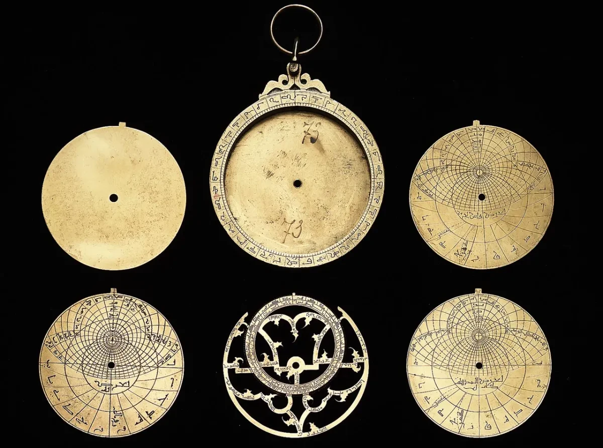 The deconstructed brass parts of an astrolabe.