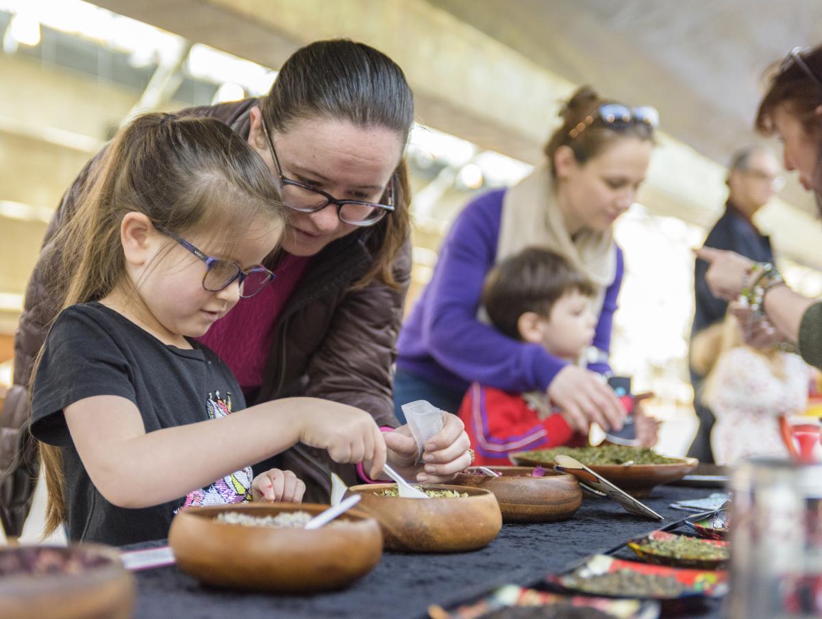 Families taking part in a tea making workshop