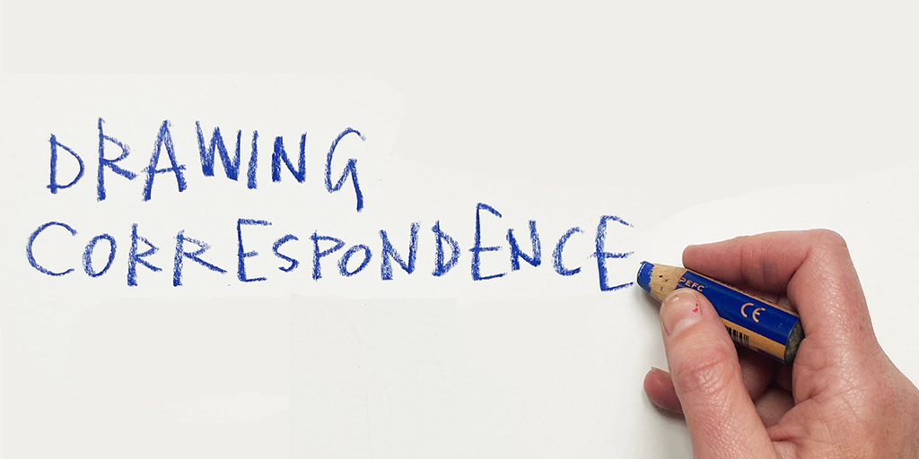 A hand writing in blue pencil