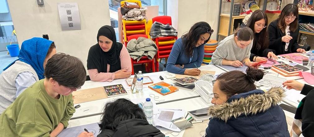 women in a drawing class