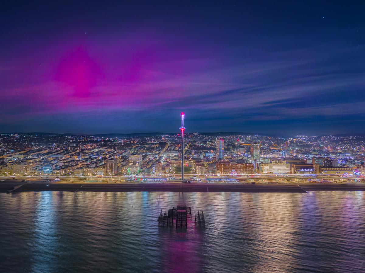 Pink aurorae over Brighton seafront