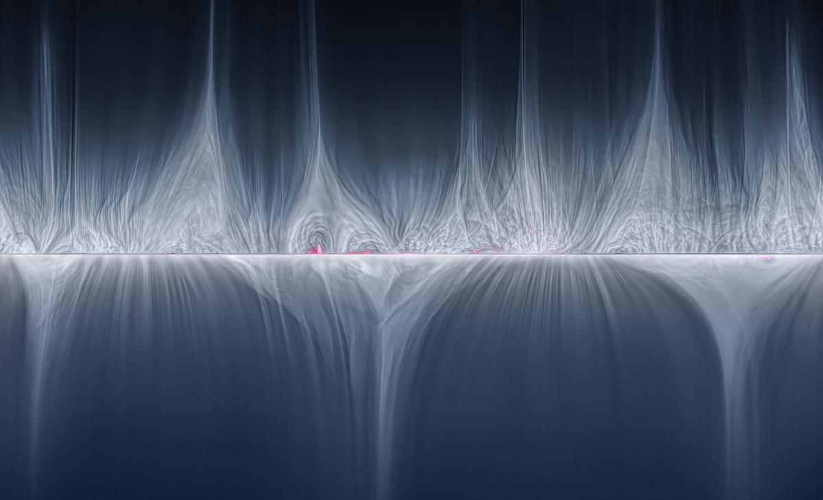 A white strip of light bisects a dark blue background, with waves of light bouncing up and down the central line