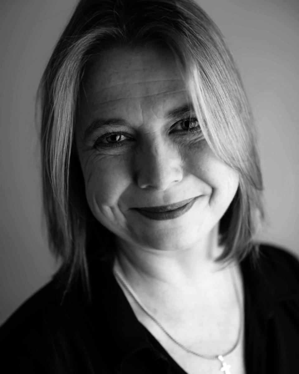 B&W headshot of a white woman with blonde hair