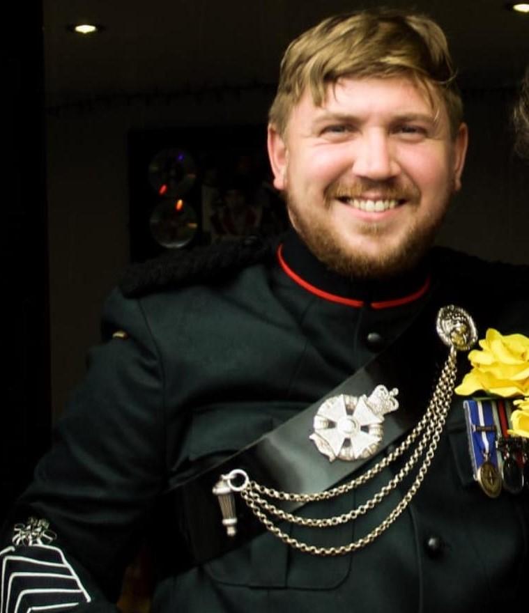 colour photo of a man with facial hair and military uniform with medals